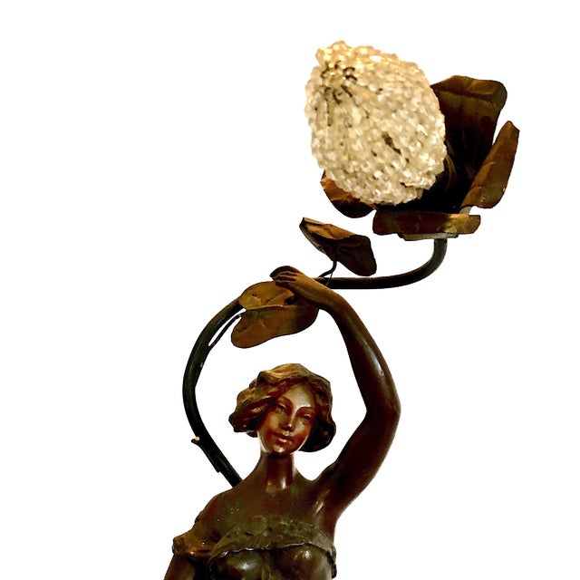 On offer is an Art Nouveau figural table lamp dating from the late 19th century to early 20th century (circa 1890–1915), a...