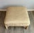 Beautiful, vintage rattan ottoman with a crème-wash finish and leather-wrapped joints by McGuire, San Francisco. Feather...