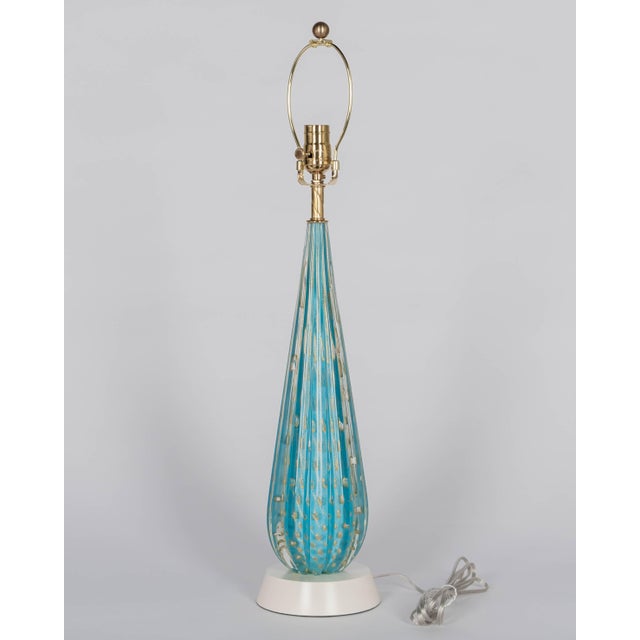 A Mid Century Murano glass lamp by Alfredo Barbini for Seguso. Hand-blown cased glass with ribbed form. Beautiful light...