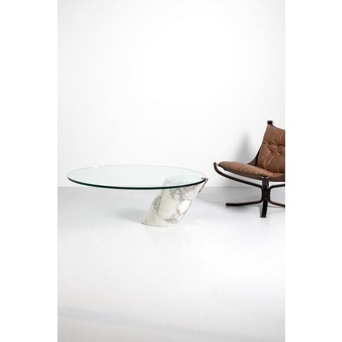 Ronald schmitt coffee table k1000 made in the 70’s in germany. The thick glass top is resting on the heavy marble base. A...