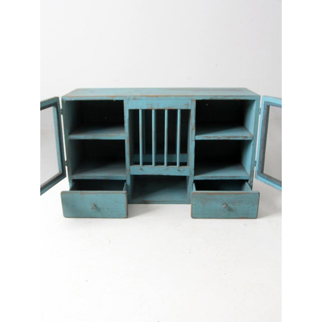 This is a vintage painted countertop cabinet circa 1940s. In a beautiful robin's egg blue tone, the rustic wood farmhouse...