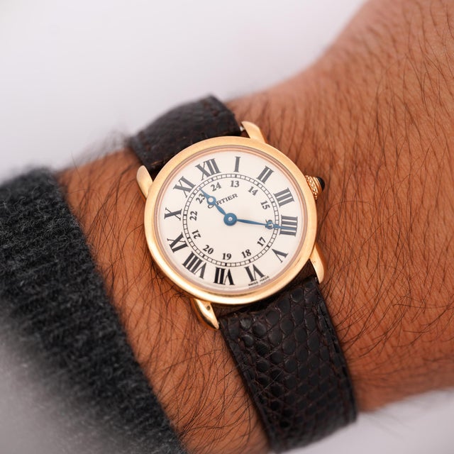 Vintage Cartier Ronde Louis 18K yellow gold quartz watch, reference 2886, featuring a cream Roman numeral dial with inner...