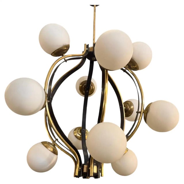 This exquisite mid-century modern chandelier by Stilnovo captures the essence of sophisticated Italian lighting design...