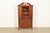 A beautiful Georgian or Federal style bookcase cabinet or dining cabinet In the manner of Baker Furniture USA, Circa 1940s...