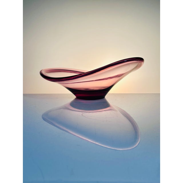 An elegant, sculptural glass bowl by swedish designer lotte petterson for ikea. The softly curved, organic form with its...