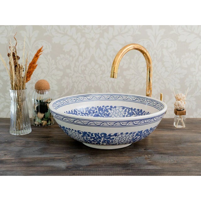 1) Elevate the Beauty of your bathroom sink with our Custom Sink. This ceramic vessel sink is skillfully handcrafted by...