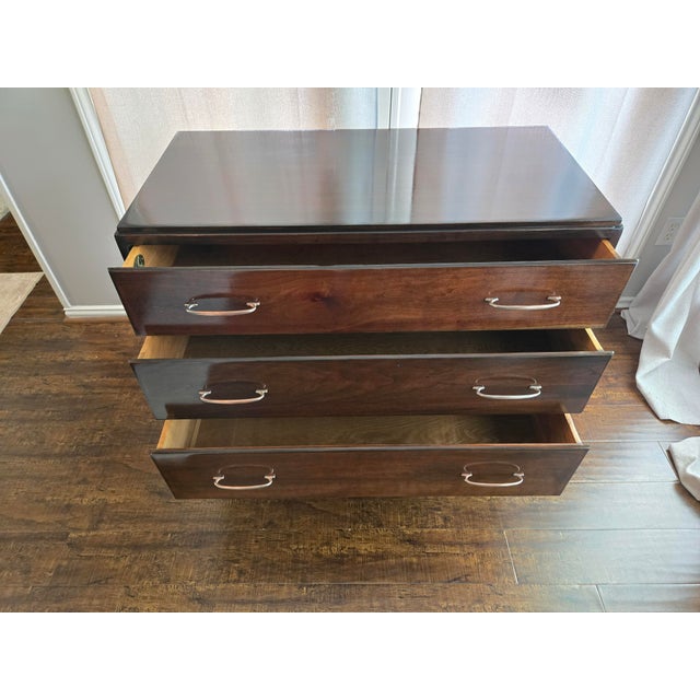 Beautifully tapered mid-century legs and sleek silhouette. 3 spacious, deep drawers with dovetailed joints that glide...