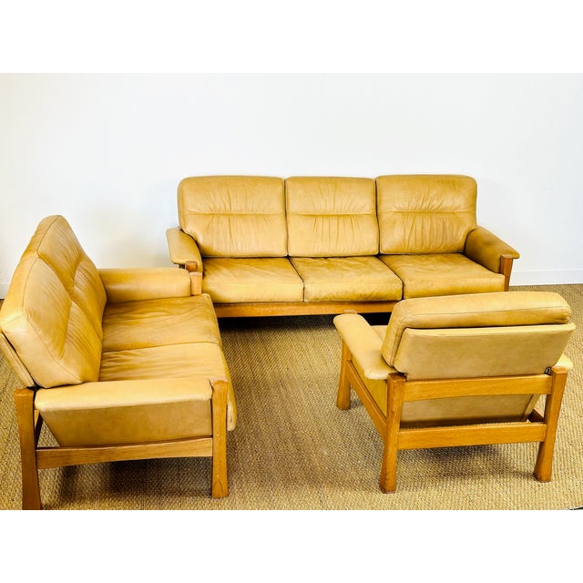 An exceptional living room set in the style of pierre chapo or børge mogensen, perfectly illustrating the understated and...