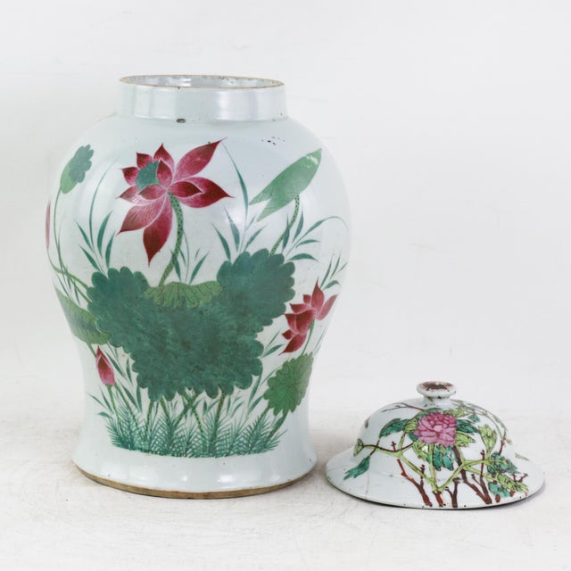 This exquisite antique ginger jar is crafted from high-quality porcelain and features a vibrant, hand-painted Famille Rose...