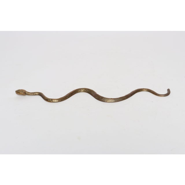 Art Deco cast-brass snake sculpture (ca. 1930s, USA). Hammered details are faithfully representative of scales. Elegant...