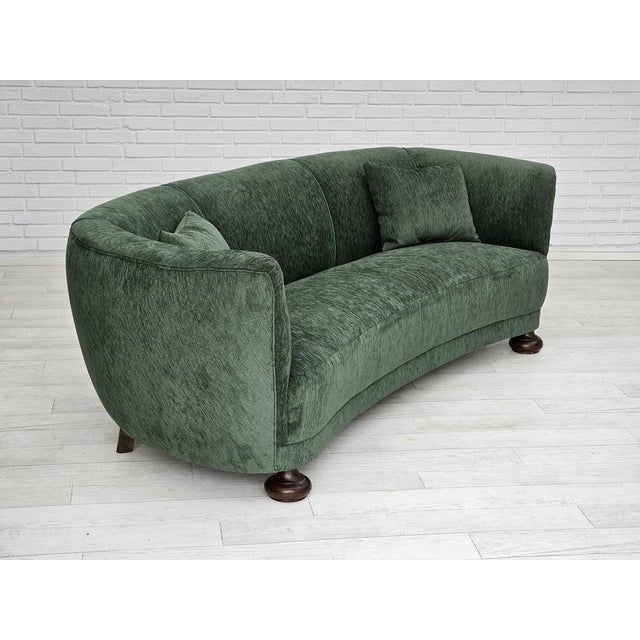 1960s, Danish design. Refurbished-reupholstered 3 seater "Banana" sofa in quality vintage bottle green velor, two extra...