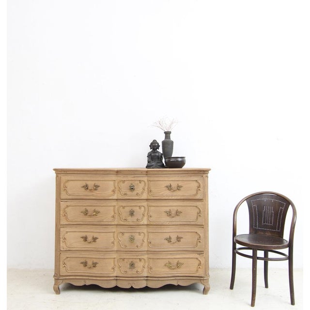 Provincial four-drawer chest of drawers with ‘en arbalète’ front. Louis XV style, early 19th century. Crafted from solid...