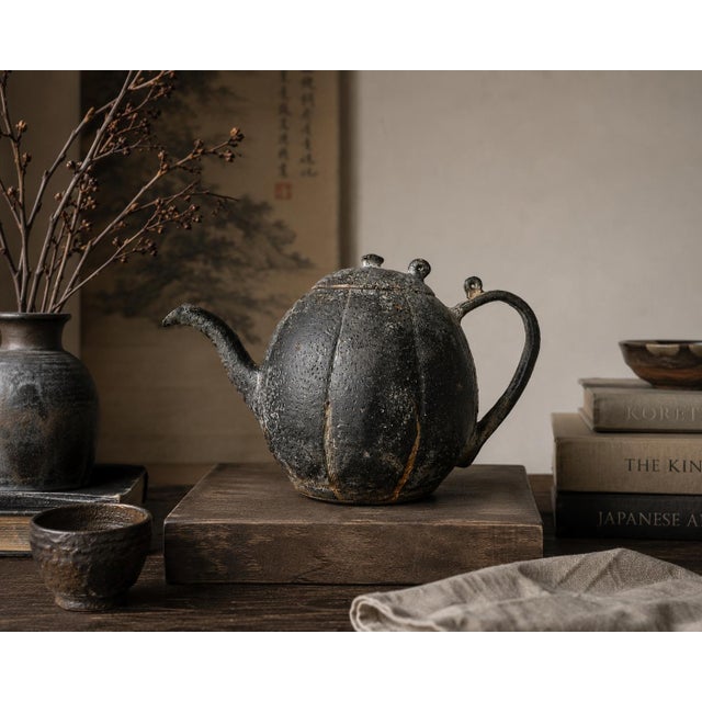 A beautifully sculptural 19th century Japanese cast iron chagama or tetsubin teapot featuring an unusual pumpkin-form body...