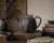 A beautifully sculptural 19th century Japanese cast iron chagama or tetsubin teapot featuring an unusual pumpkin-form body...