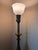 A striking vintage torchiere lamp by Rembrandt Lamp Company featuring richly detailed neoclassical styling and an elegant...