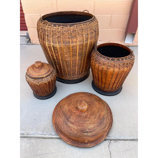 Vintage Trio of Lidded Boho Woven Rattan Containers. Beautiful rust colors with woven rattan throughout, lidded. 1...