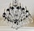 A large bronze and crystal chandelier. The Louis XV Birdcage holds fifteen lights in an elegant round form. French from...