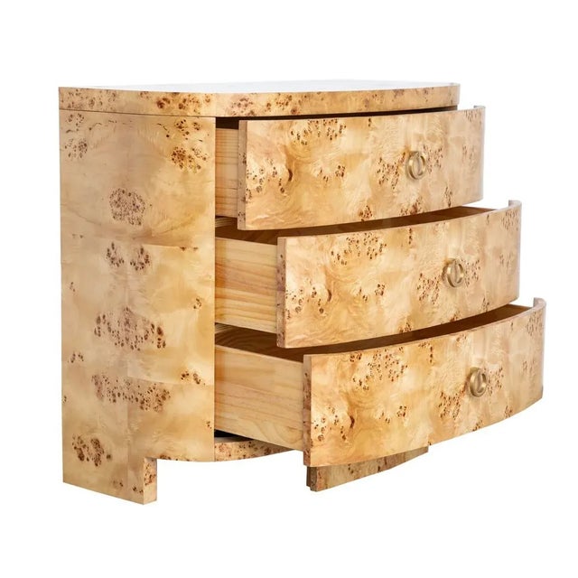 Elegant demilune light Burlwood chest with three drawers. Lovely brushed brass hardware. Soft close glides. *Wood has...