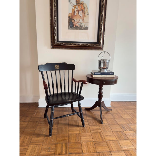 This vintage Windsor-style captain’s chair was designed for formal university settings and often given to alumni as a...