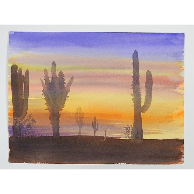 Late 20th century watercolor on paper painting of desert and cactus at sunset. Unsigned. Unframed.