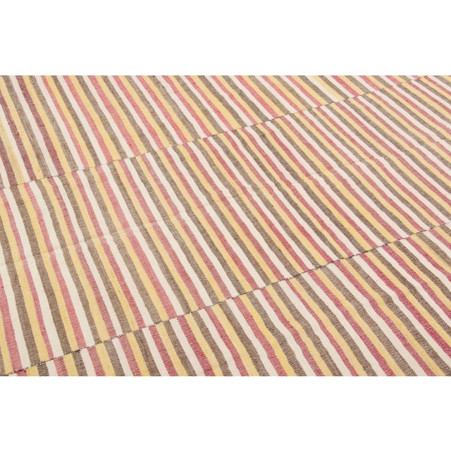 Handwoven in pure wool and originating circa 1950-1959, this 6x8 vintage Turkish kilim joins Rug & Kilim’s Kilim & Flat...
