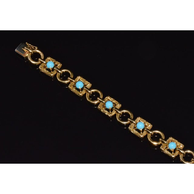 Vintage Mid-Century 18K solid gold Persian turquoise link bracelet. This bracelet has a bold, finely crafted design...