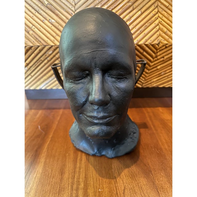 Really handsome heavy plaster male face suspended on metal stand. Striking studio piece. Low sheen black finish. Open...