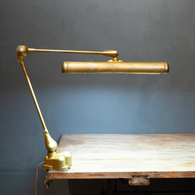 ABOUT An original fully adjustable Art Deco floating arm articulating desk lamp. Large clamp secures to any table....
