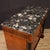 Italian chest of drawers from the second half of the 20th century. Empire style furniture veneered in burl and ebonized...
