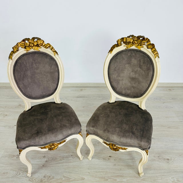 Dimensions: H 39.5” x W 19” x SD 17” x SH 19” Pair of Vintage French Louis XVI style accent chairs, newly upholstered in...