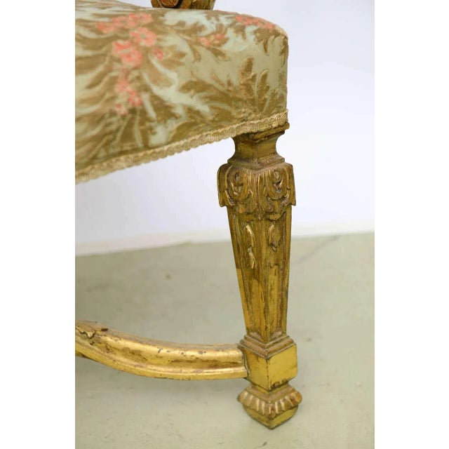An opulent pair of 19th century Louis XIV style grand scale Bergeres- high back Gold Leaf carved wood frame throne chairs,...