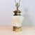 A substantial Stiffel table lamp with a faceted cream ceramic body in an octagonal urn shape, capped top and bottom in...