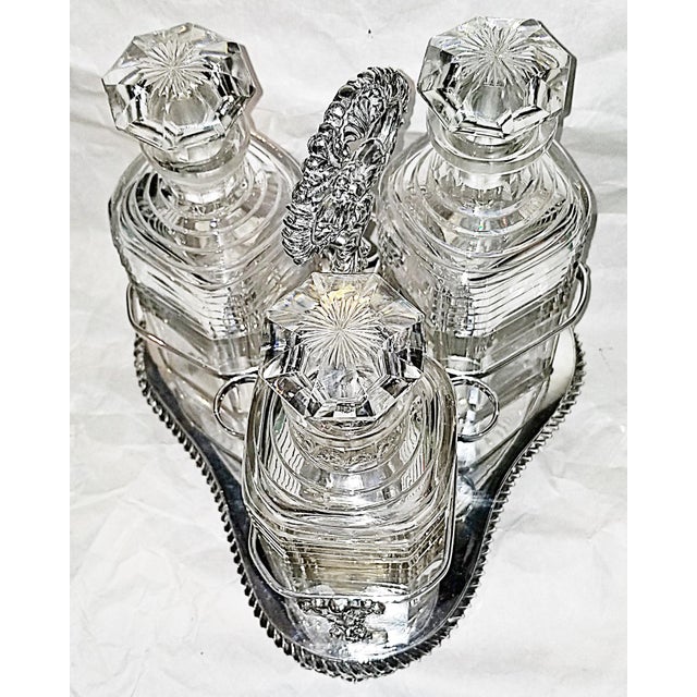This decanter set will be the centerpiece of any bar, from 19c England with 3 heavy cut crystal ribbed decanters fitted to...