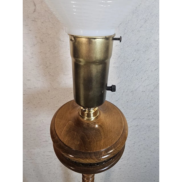 Bring classic elegance to your space with this torchiere-style wooden floor lamp. Standing 54" tall, it features a...