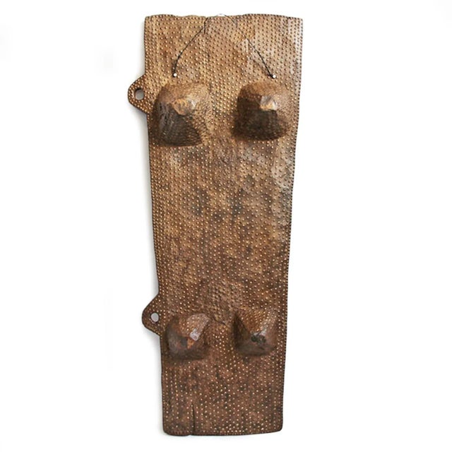 Vintage original Angola Uncombe tribal carved wood bed. Beautifully decorated and embellished with bronze tabs all over....