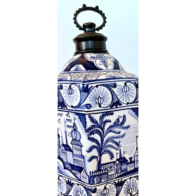 Beautiful blue pottery in a hexagon bottle shape acquired in Budapest Hungary. Unusual royal blue color scheme for pottery...