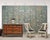 A monumental and decorative eight-panel Chinoiserie folding wallpaper screen attributed to Gracie. The grand screen...