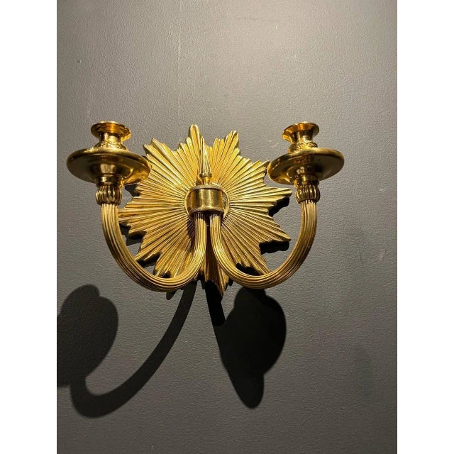A pair of circa 1920’s gilt bronze double light sconces