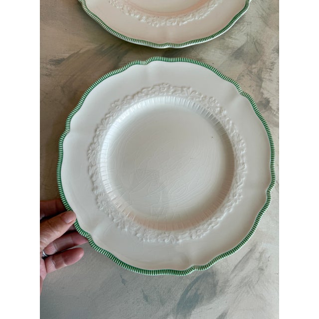 This set of two vintage plates was made in England by Johnson Bros and marked Old Staffordshire. Featuring softly...