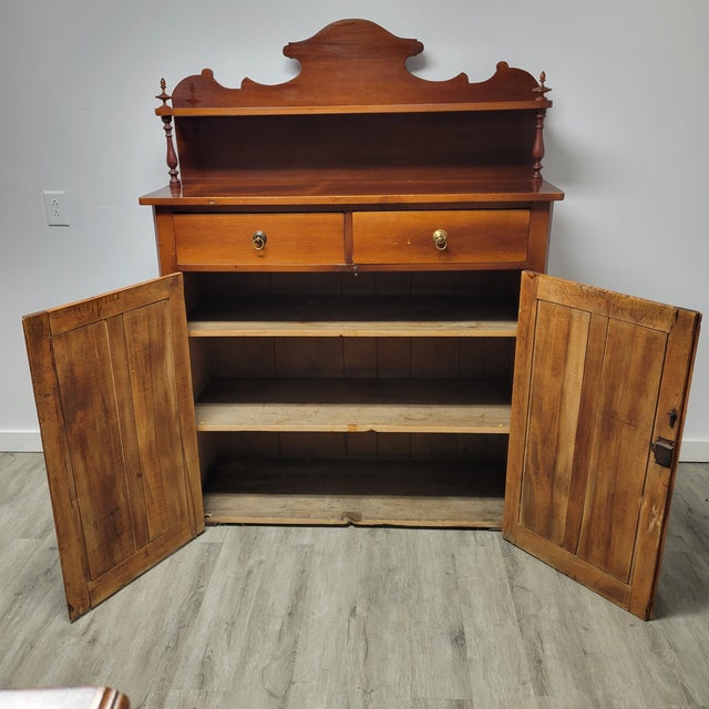 This charming American jelly cupboard, crafted circa 1900, is made of warm cherry wood and retains its original character...