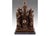 This solid bronze sculpture is a complex commemorative work featuring several figures symbolizing grief and endurance. At...