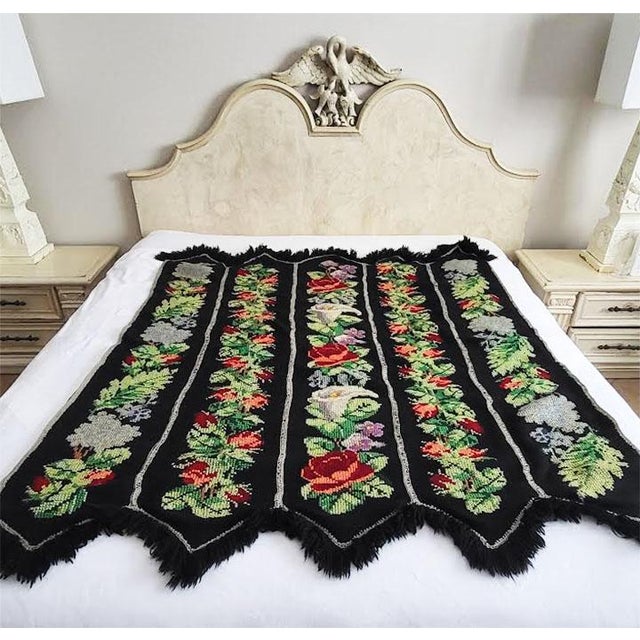 Bring a striking piece of vintage textile art into your space with this hand-embroidered afghan throw blanket. Constructed...