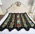 Bring a striking piece of vintage textile art into your space with this hand-embroidered afghan throw blanket. Constructed...