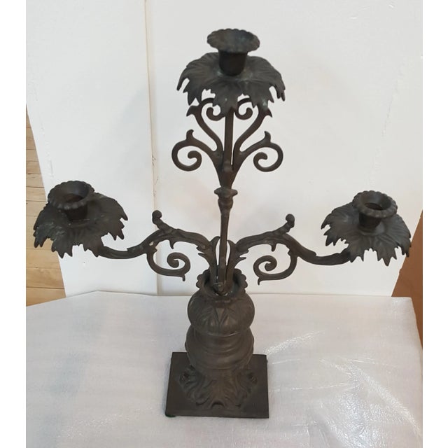 Antiqued Metal Candelabra with 3 arms. This is a showroom floor sample from Payne Imports.