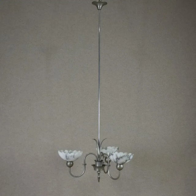 Very rare ceiling lamp by Harald Notini for Böhlmarks. Zinc galvanized on brass. This piece is attributed to the mentioned...