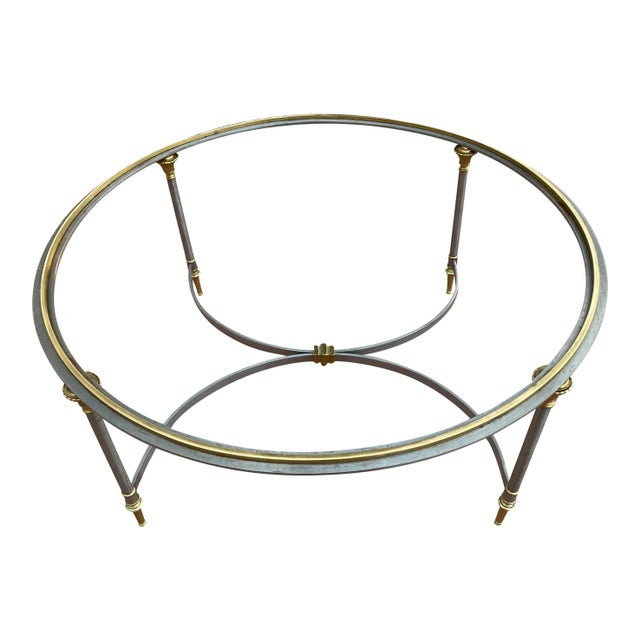Rare French Directoire style round steel coffee table having brass mounts and glass inset top, manner of Maison Charles,...