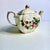 Circa 1940 James Sadler Creamy Ceramic Cube Teapot with Fruit and Gilt. Adorned with blossoms, blackberries, an apple,...