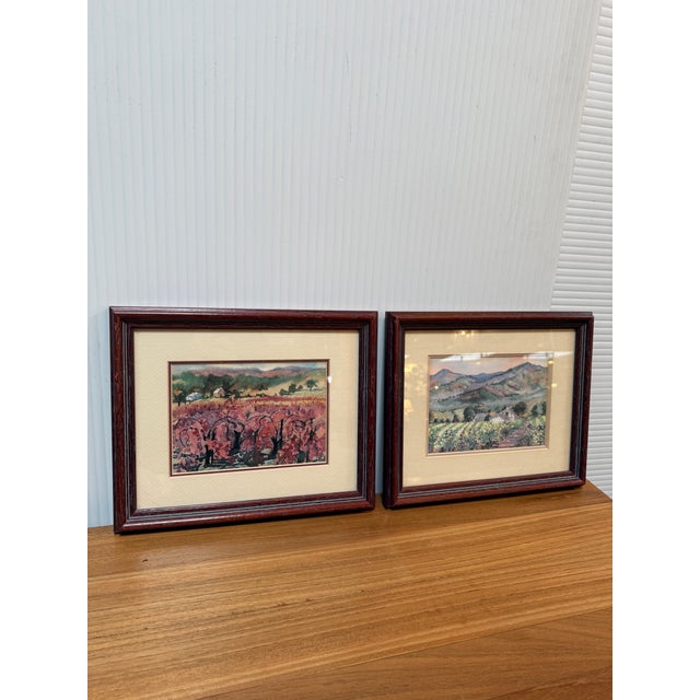 Design Plus Gallery presents a Set of Two Landscape Watercolors by Ellie Marshall. The flowering pictures show fields of...