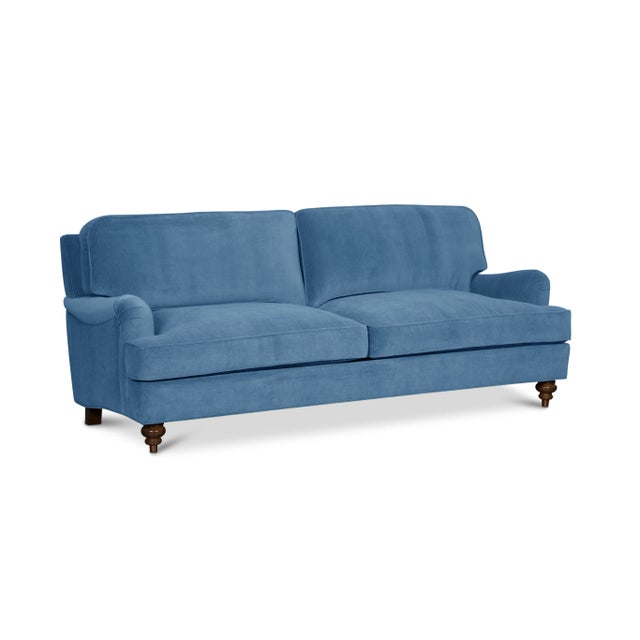 Timeless style meets luxurious comfort in this high-end English Roll Arm sofa. Upholstered in 100% cotton velvet with a...