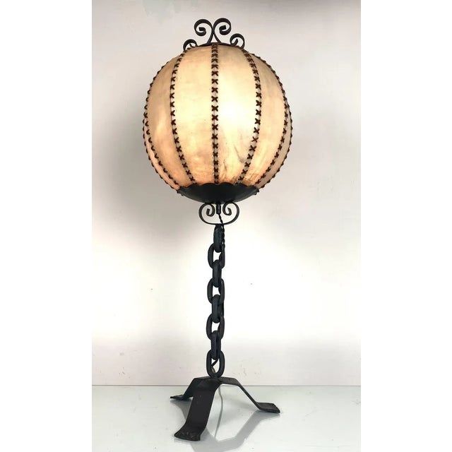 Vintage wrought iron chain brutalist table lamp with the authentic round leather lampshade. This is a rare and complete...